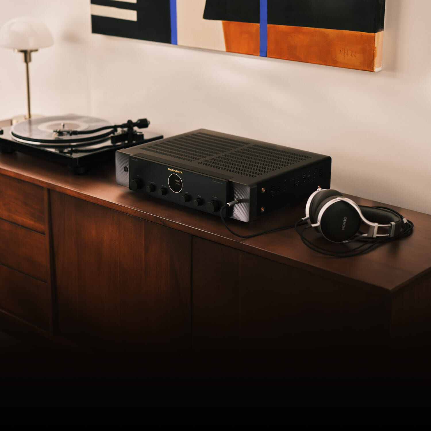 Silver-Gold Model 70 lifestyle image facing left sitting on wooden console